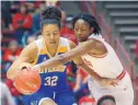  ??  ?? Lobo Jordan Hosey, right, knocks the ball away from UC Riverside’s Bryanna Brady (32) during New Mexico’s 80-70 comeback victory Tuesday night at the Pit.