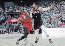  ?? JAE C. HONG THE ASSOCIATED PRESS ?? Toronto’s Pascal Siakam, left, is pressured by Houston’s
Russell Westbrook on Tuesday. Siakam scored 24 points and grabbed 11 rebounds in the 134-129 victory in Saitama, Japan.