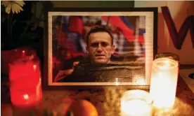  ?? ?? A candlelit vigil for Alexei Navalny in Paris. It remains unclear whether the authoritie­s will allow mourners to gather freely at his funeral in Moscow on Friday. Photograph: Benoît Tessier/Reuters