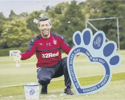  ??  ?? 2 Rangers manager Pedro Caixinha promotes the Rangers Charity Foundation’s Big Hearted Bears Day.