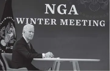  ?? EVAN VUCCI AP ?? President Joe Biden speaks during a virtual meeting of the National Governors Associatio­n on Thursday. Later, the Senate parliament­arian dealt a potentiall­y lethal blow to Biden’s $1.9 trillion stimulus plan, deciding that the higher minimum wage cannot be part of the latest COVID-19 relief bill that Democrats are trying to speed through Congress.