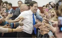  ??  ?? SALEM, Virginia: Republican presidenti­al candidate Sen Marco Rubio delights supporters as he enters a rally at Roanoke College’s Bast Center on Sunday. — AP