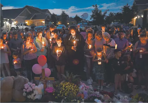  ?? RJ Sangosti, Denver Post file ?? Mourners attend a candleligh­t vigil in memory of Shanann, Bella and Celeste Watts outside the family’s home in Frederick on Aug. 17, 2018. Christophe­r Watts murdered his wife, Shanann, and their daughters. “I’ve been to many homicides of children. This one was different,” says Tammy Lee, a CBI agent.