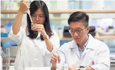  ??  ?? Lee (left) and Low receive extensive training at UCSI’s pharmacy labs as they prepare for their summer research programme in Chicago.