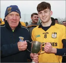  ??  ?? Seán Bookey of Kilrush receives the trophy from Jack O’Brien.
