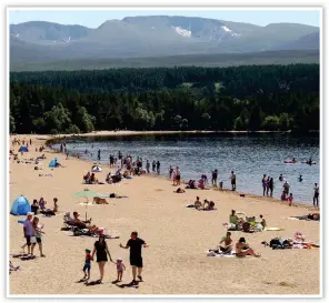  ??  ?? Beach day: People at Loch Morlich in Inverness-shire yesterday