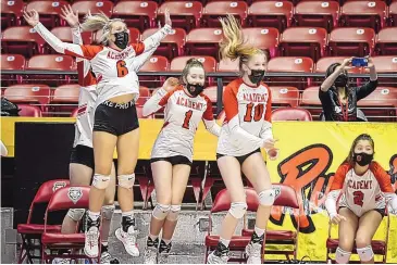  ?? ROBERTO E. ROSALES/JOURNAL ?? Albuquerqu­e Academy players leap off the bench after the Chargers clinched the Class 4A championsh­ip with a three-sets victory over top-seeded Goddard on Friday in the Pit.