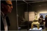  ?? MAY ZHOU / CHINA DAILY ?? Chinese art collector Leopold Swergold and the latest addition to his collection —a Shykyamuni Buddha gilt bronze from Western Wei period.