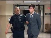  ?? CARL HESSLER JR. — MEDIANEWS GROUP ?? Logan Dierkes, 20, is escorted by a deputy sheriff from a Montgomery County courtroom after he pleaded guilty to a charge of vehiclular homicide.