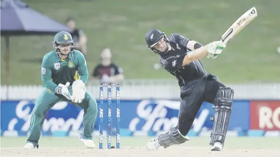  ?? Picture: AFP ?? FETCH. New Zealand opener Martin Guptill blazes another boundary on his way to an unbeaten 180 in the fourth one-day internatio­nal against the Proteas in Hamilton yesterday as wicketkeep­er Quinton de Kock look on. The Kiwis won by seven wickets.