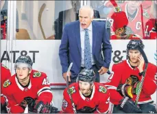  ??  ?? Chicago Blackhawks head coach Joel Quennevill­e yells to his team during the third period of an NHL hockey game in 2017.