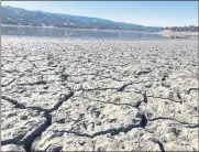  ??  ?? An exposed dry bed is seen at Lake Mendocino near Ukiah. The area has seen little rain in the past two years.