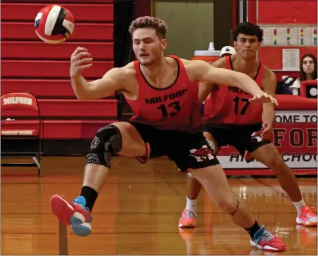  ?? STAFF PHOTO BY STUART CAHILL — BOSTON HERALD ?? Milford’s Joey Newman reaches for the spike as Lexington takes on Milford in boys volleyball on April 18.