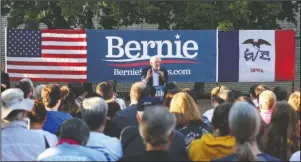  ?? The Associated Press ?? BERNIE: Democratic presidenti­al candidate U.S. Sen. Bernie Sanders, I-Vt., speaking during a brief campaign stop at Town Clock Plaza in Dubuque, Iowa, Monday.