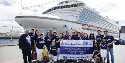  ??  ?? THE FAMTRIP GROUP. Wearing blue PAL shirts, the group poses for a souvenir photo before boarding the Emerald Princess.