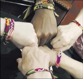  ?? Instagram ?? Friendship bracelets are given out at his shows.
Richard Sedler of Las Vegas signs up for the fan club at a concert at the Suncoast Showroom with Kathy Cornelius, who readies a bracelet like the ones Moreno has worn since he was a kid growing up in...