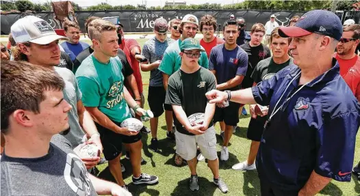  ?? Brett Coomer / Houston Chronicle ?? Texans coach Bill O'Brien, right, has the undivided attention of a group of Santa Fe football players following a Texans minicamp workout at The Methodist Training Center on Tuesday. The Texans tried to give their visitors a bit of a respite from the tragedy that struck their high school.