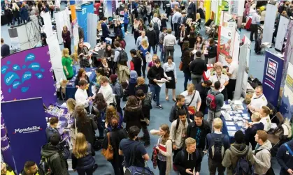  ?? Photograph: Christophe­r Thomond/The Guardian ?? A careers fair in Leeds. Universiti­es have been urged to steer their students towards careers with long-term prospects that do not damage the planet.