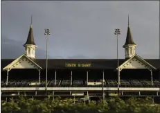  ??  ?? The sun rises over the track at Churchill Downs, Thursday, May 7, 2020, in Louisville, Ky. The Kentucky Derby has been postponed until Sept. 5 because of the coronaviru­s.