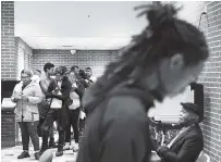  ?? AP PHOTO/DAVID GOLDMAN ?? Voters wait in line on Election Day after an order issued in Fulton County Superior Court ordered the polling location to remain open until 10 p.m.