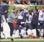  ?? Frank Victores / Associated Press ?? New England Patriots cornerback Stephon Gilmore runs in a touchdown off an intercepti­on in the second half against the Cincinnati Bengals on Sunday in Cincinnati.