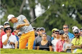  ?? THE ASSOCIATED PRESS ?? Rickie Fowler hits his tee shot on the 17th hole during the final round of the PGA Championsh­ip at the Quail Hollow Club on Sunday in Charlotte, N.C.