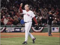  ?? Winslow Townson / Associated Press ?? Red Sox pitcher Curt Schilling tips his hat as he walks off the field after being taken out of Game 2 of the 2007 World Series against the Rockies at Fenway Park.