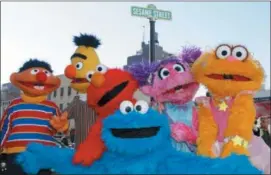  ?? KATHY WILLENS — THE ASSOCIATED PRESS FILE ?? In this file photo, characters from Sesame Street Live appear on the street by Madison Square Garden to celebrate the 30th anniversar­y of the live touring stage shows based on the PBS television series. in New York.