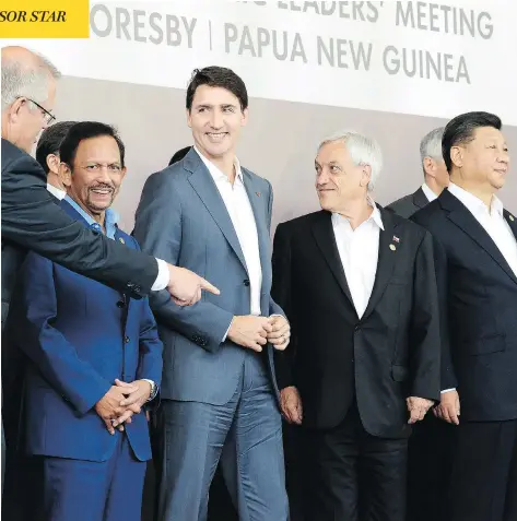  ?? ADRIAN WYLD/THE CANADIAN PRESS ?? From left, Australian Prime Minister Scott Morrison, Brunei’s Sultan Hassanal Bolkiah, Prime Minister Justin Trudeau, Chile’s President Sebastian Pinera, China’s President Xi Jinping and other leaders assemble on Sunday for a photo at the APEC Summit in Port Moresby, Papua New Guinea.