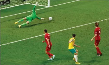  ?? Photograph: Albert Gea/Reuters ?? Mathew Leckie scores Australia’s winning goal against Denmark.