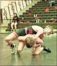  ?? Barbara hall ?? A Sonoravill­e wrestler has a hold on his Calhoun opponent at last week’s Calhoun New Year’s Duals tournament at the high school