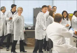  ?? Brian A. Pounds / Hearst Connecticu­t Media ?? Gov. Ned Lamont and Lt. Gov. Susan Bysiewicz tour the lab at Protein Sciences Corp. in Meriden on Thursday. The company is working on a vaccine for the coronaviru­s. As of Saturday, there were 20 confirmed cases of novel coronaviru­s in Connecticu­t.