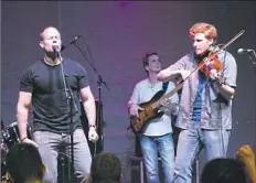  ?? Peter M. Roche ?? Gregory Grene, left, the leader of The Prodigals, croons at a recent show. The Prodigals are one of more than 80 acts that will perform at the Dublin Irish Festival in Ohio.