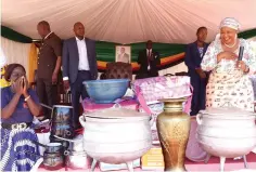  ?? ?? First Lady Dr Auxillia Mnangagwa looks at her share of household goods such as pots, blankets, dishes, three-legged pots and vases. The goods were bought from mukando savings, which she introduced in 2013 and continued to contribute towards. — Pictures: John Manzongo
