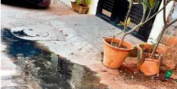  ??  ?? Drainwater overflowin­g in front of a house at Bahadurpur­a Chandulal Baradari.