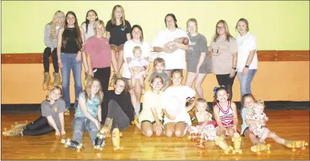  ?? Katie West • Times-Herald ?? Junior Auxiliary of St. Francis County hosted a skating party Monday night for JA G.E.M.S members. JA G.E.M.S. is a mentoring program supported by JASFC. Several members of the group, shown above, enjoyed an evening of skating at Wheely T’s in Palestine.