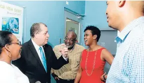  ??  ?? After a tour of the new First Global Bank Portmore branch, in conversati­on are (from left) Grace Burnett, chief executive officer, GraceKenne­dy Financial Group; Audley Shaw, finance minister; Fitz Jackson, member of parliament, St Catherine Southern;...
