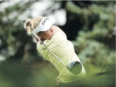  ?? — GETTY IMAGES ?? Brooke Henderson hits her tee shot on the third hole Saturday during the third round of the Meijer LPGA Classic at Blythefiel­d Country Club in Grand Rapids, Mich.