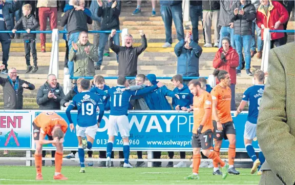  ?? Picture: SNS. ?? Stephen Dobbie celebrates scoring for Queen of the South as United fail on their travels again.