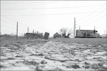  ?? NWA Democrat-Gazette/CHARLIE KAIJO ?? A road sign is displayed Friday near a dirt mound next to a road under constructi­on on the corner of Allen Road and Centerton Boulevard in Centerton. Residents will decide Tuesday if they want to extend a 1-cent sales tax to pay for road improvemen­t,...