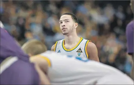  ?? Katie Falkenberg For The Times ?? TYLER HONEYCUTT, an All-Pac-10 player at UCLA, didn’t make it in the NBA but was carving out a career playing overseas. But the 28-year-old felt isolated away from home. He stunned everyone when he turned a gun on police during a standoff, then on himself.