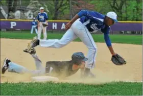  ?? BARRY TAGLIEBER - FOR DIGITAL FIRST MEDIA ?? Norristown’s first baseman Zhakir Watson chases an overthrown ball as Phoenixvil­le’s Quinn Danna slides back to the bag during their game Wednesday.