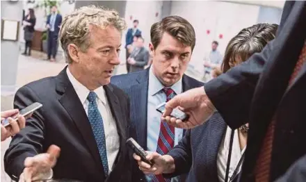  ?? EPA PIC ?? Republican Senator from Kentucky Rand Paul (left) talking to reporters in the US Capitol in Washington, DC on Thursday.