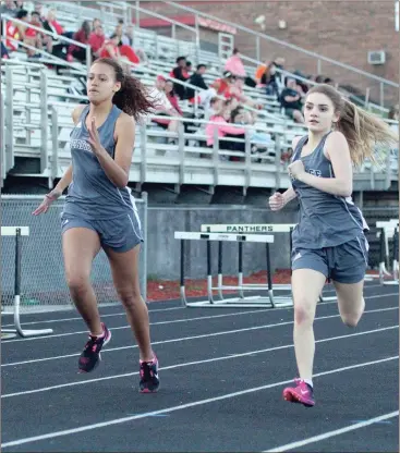  ??  ?? Meliah Postell and Erin Justice spring toward the finish line during the girls’ 100-meter event at Ridgeland on Thursday. The Heritage track team is scheduled in three meets this week, at Southeast on Tuesday, at home on Thursday and at Gordon Central...