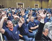  ?? Robert Gauthier Los Angeles Times ?? L.A. COUNTY firefighte­r Tim Brun, left, joins others protesting the constructi­on of new cell towers.