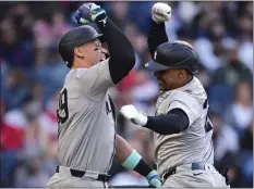 ?? DAVID DERMER — THE ASSOCIATED PRESS ?? The Yankees’ Juan Soto, right, is congratula­ted by Aaron Judge after Soto hit a three-run homer in the fourth inning of Saturday’s second game in Cleveland.