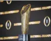  ?? AP file photo ?? The CFP trophy is shown. The expanded 12-team CFP will be played in 2024.