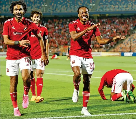  ?? ?? Ahly's Hussein el Shahat (L) celebrates with teammates after scoring against Esperance Sportive de Tunis in their CAF Champions League semi-final in Cairo on Friday (AFP)