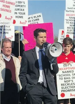  ?? POSTMEDIA NEWS ?? Mayoral candidate Glen Chernen leads a rally in Vancouver Tuesday to protest against the B.C. government’s higher school taxes on homes over $3 million.