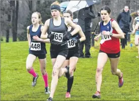  ?? FM5054120 ?? Charlotte Young, second from left, runs for Maidstone in the intermedia­te girls’ race